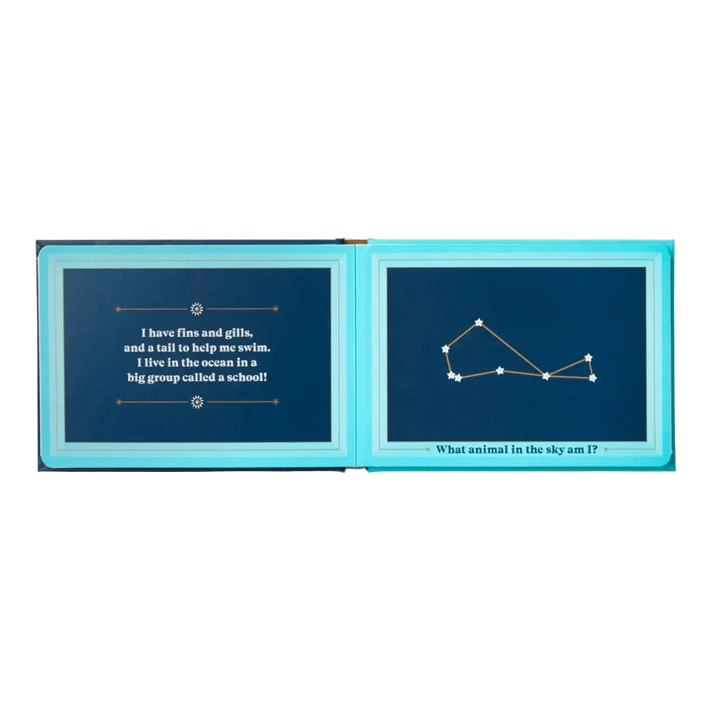 Open book with blue pages showing text and a constellation diagram on a white background