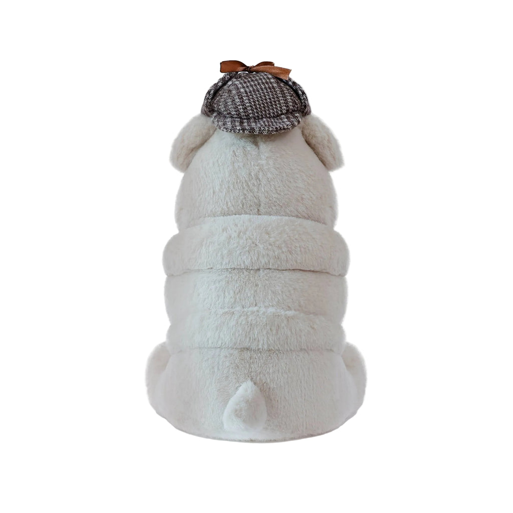 Plush toy resembling a bulldog with a tweed hat on a white background