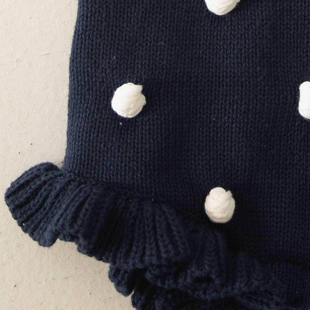 Poka Dot Navy Blue Knit Ruffle Romper