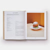 Open book showing a recipe for a Chicken Nugget BAO with a photograph of the dish on a white plate.