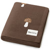 Brown fabric with mushroom design and Bleu-Lo-La label on a white background