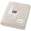 Beige blanket with embroidered deer design and Bleu-La-La label on a white background