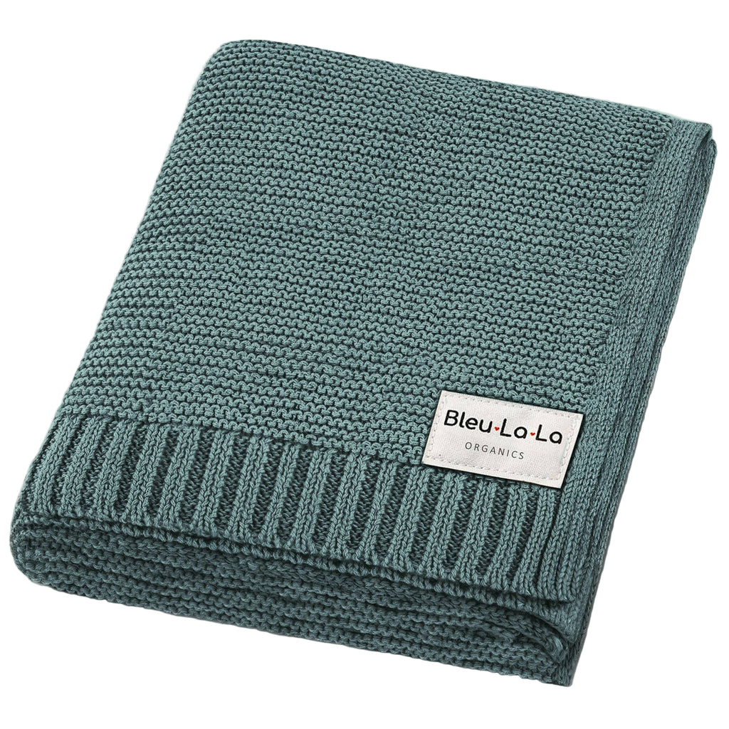 Teal knit blanket with 'Bleu La La Organics' label on a white background