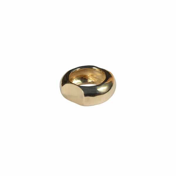 Gold ring on a light gray background