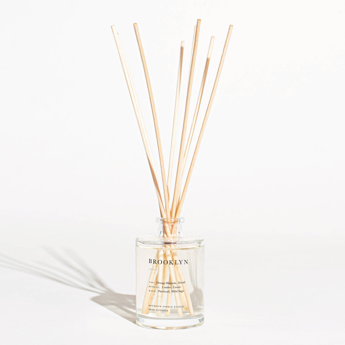 Catskills diffuser with wooden sticks on a white background