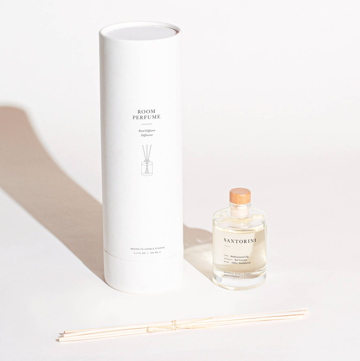 Room perfume bottle with packaging on a white background