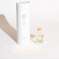 Room perfume bottle with packaging on a white background