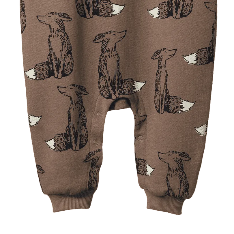 Brown pants with fox pattern on a plain background