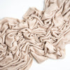 cream colored cashmere blanket on white background