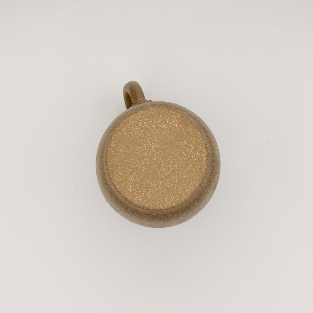 Brown ceramic mug on a white background