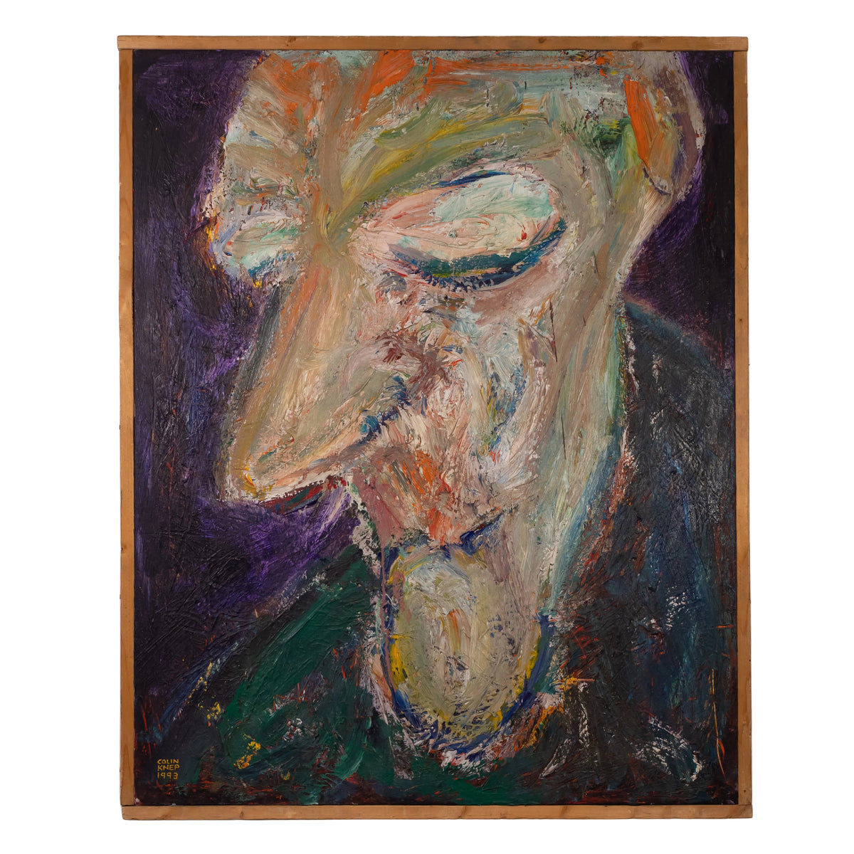 An expressive, abstract portrait painting of a face in profile, enclosed in a light wood frame and hanging on a white wall. The artwork features thick, textured brushstrokes in cream, green, purple, orange, and dark blue tones.