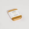Gold tin of Incense Cones with label on a white background
