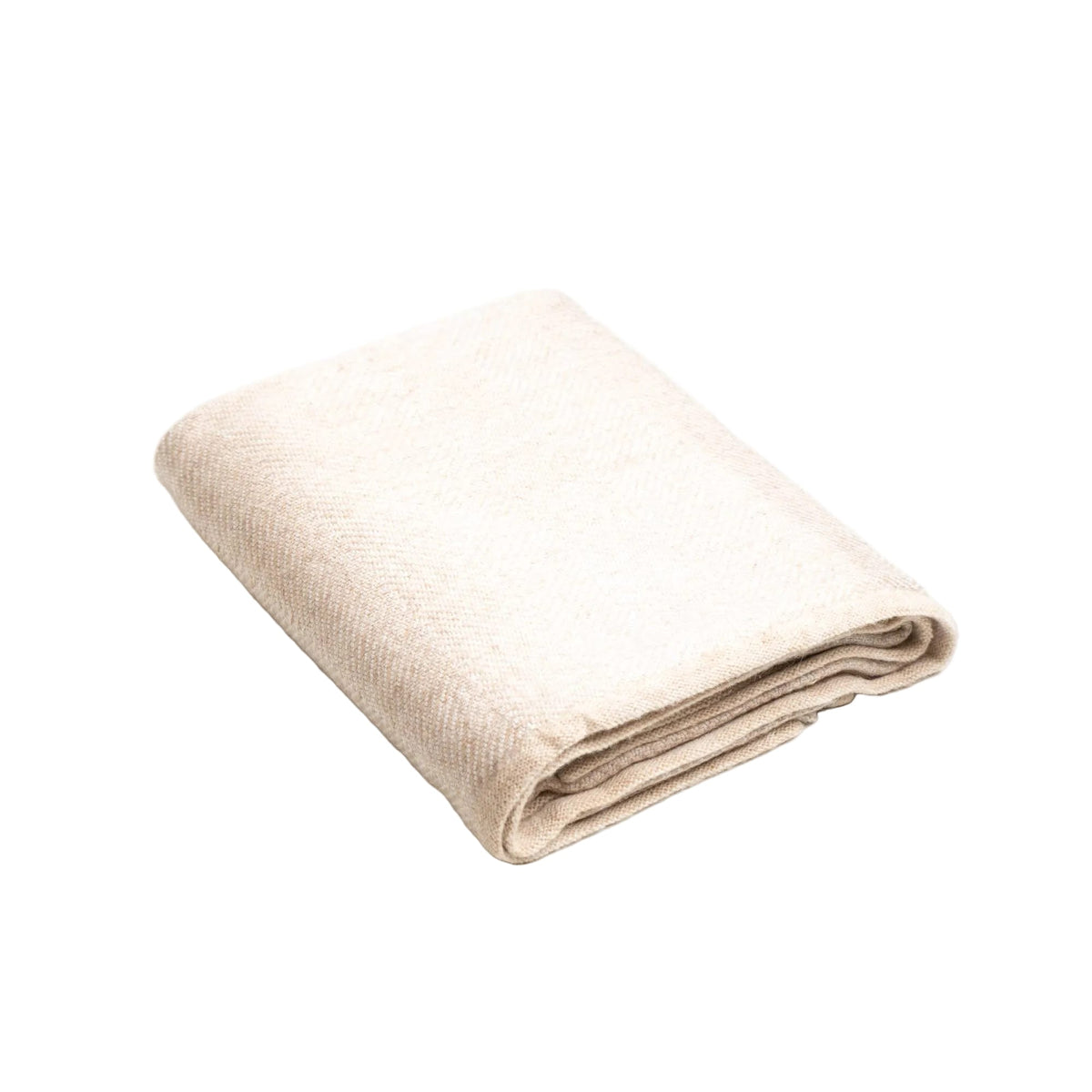 cream colored cashmere throw blanket folded on white background