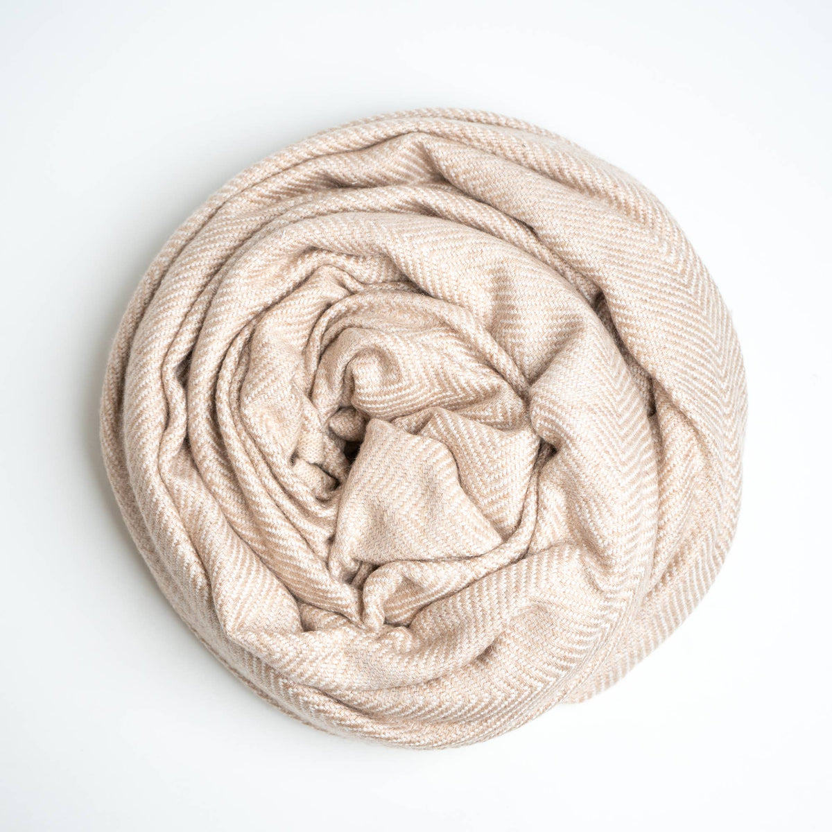 cashmere blanket rolled up on white background