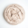 cashmere blanket rolled up on white background