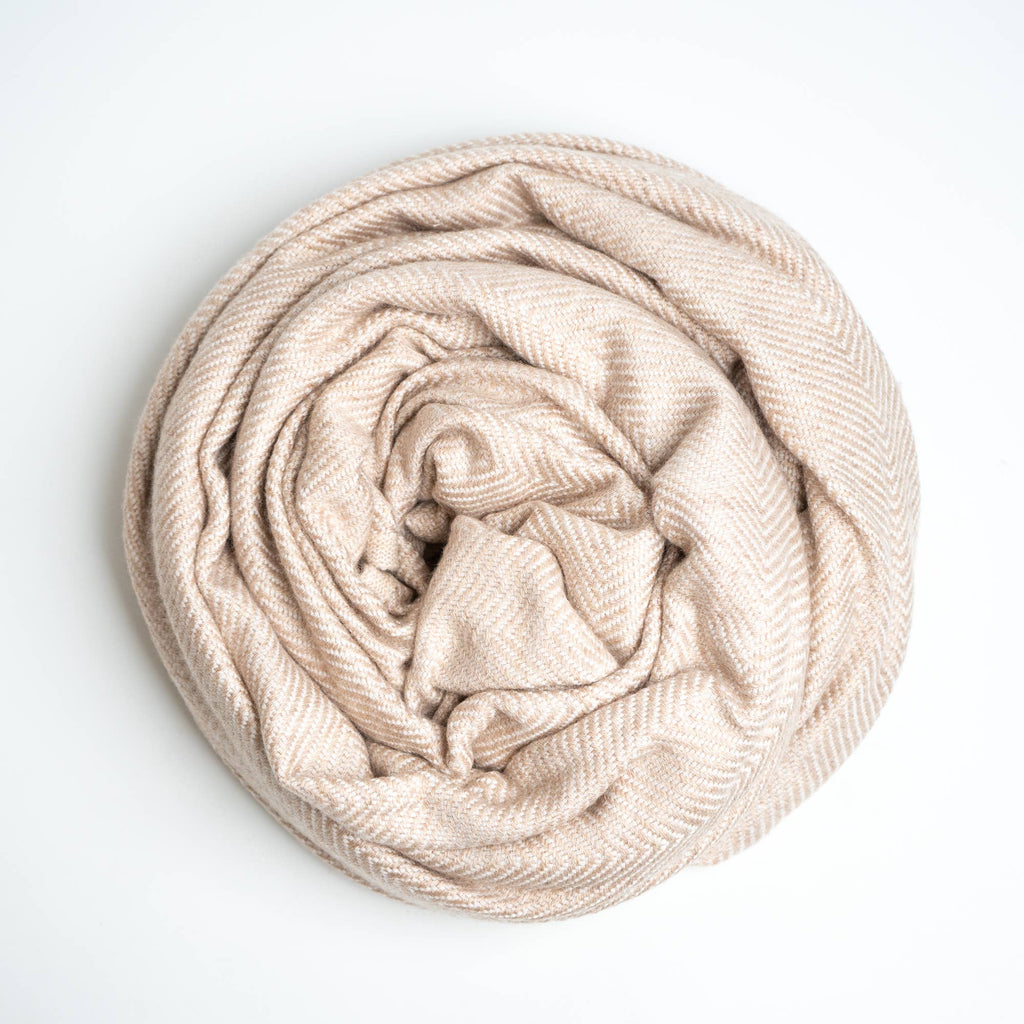 cashmere blanket rolled up on white background