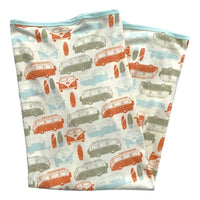 Two folded fabric swatches with vintage van pattern on a white background