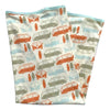 Two folded fabric swatches with vintage van pattern on a white background