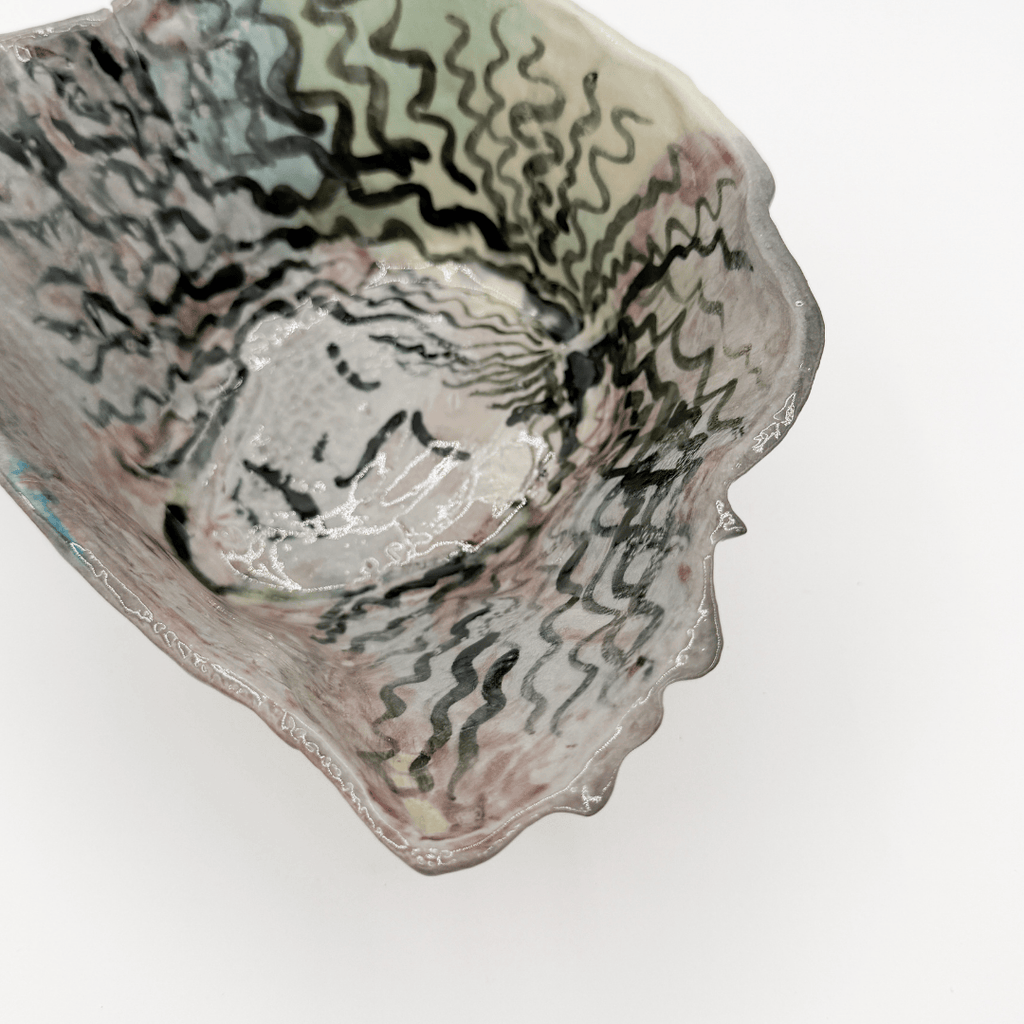 Ceramic bowl with textured surface on a white background