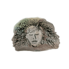 Decorative bowl with a face design on a white background