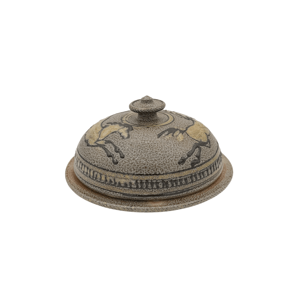 Decorative ceramic cover with horse design on a white background