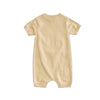 Beige baby romper on a white background