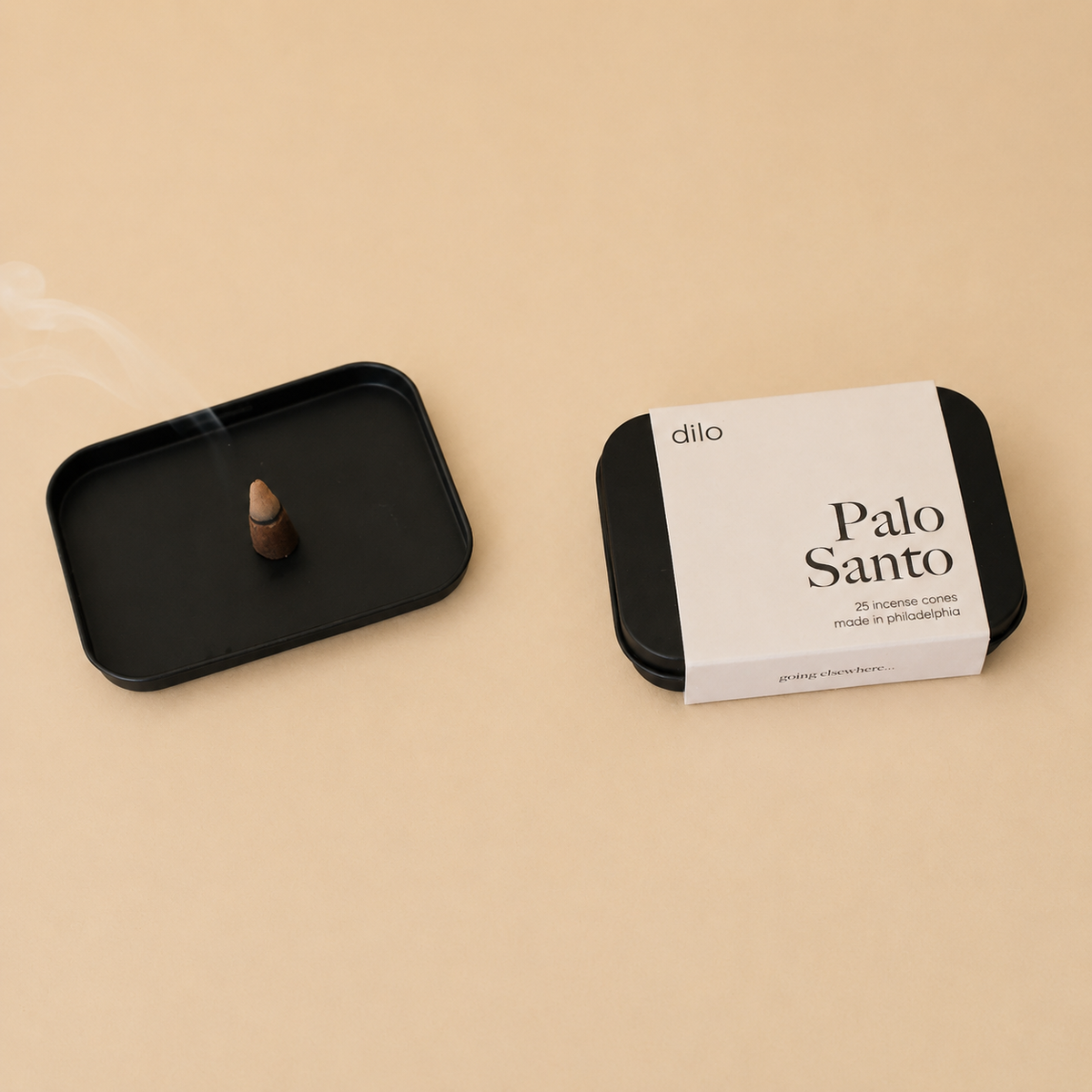 Black packaging of Palo Santo with a black tray on a beige background