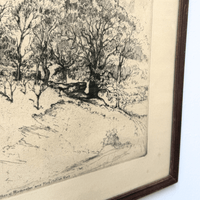 Framed black and white landscape drawing of a forest path