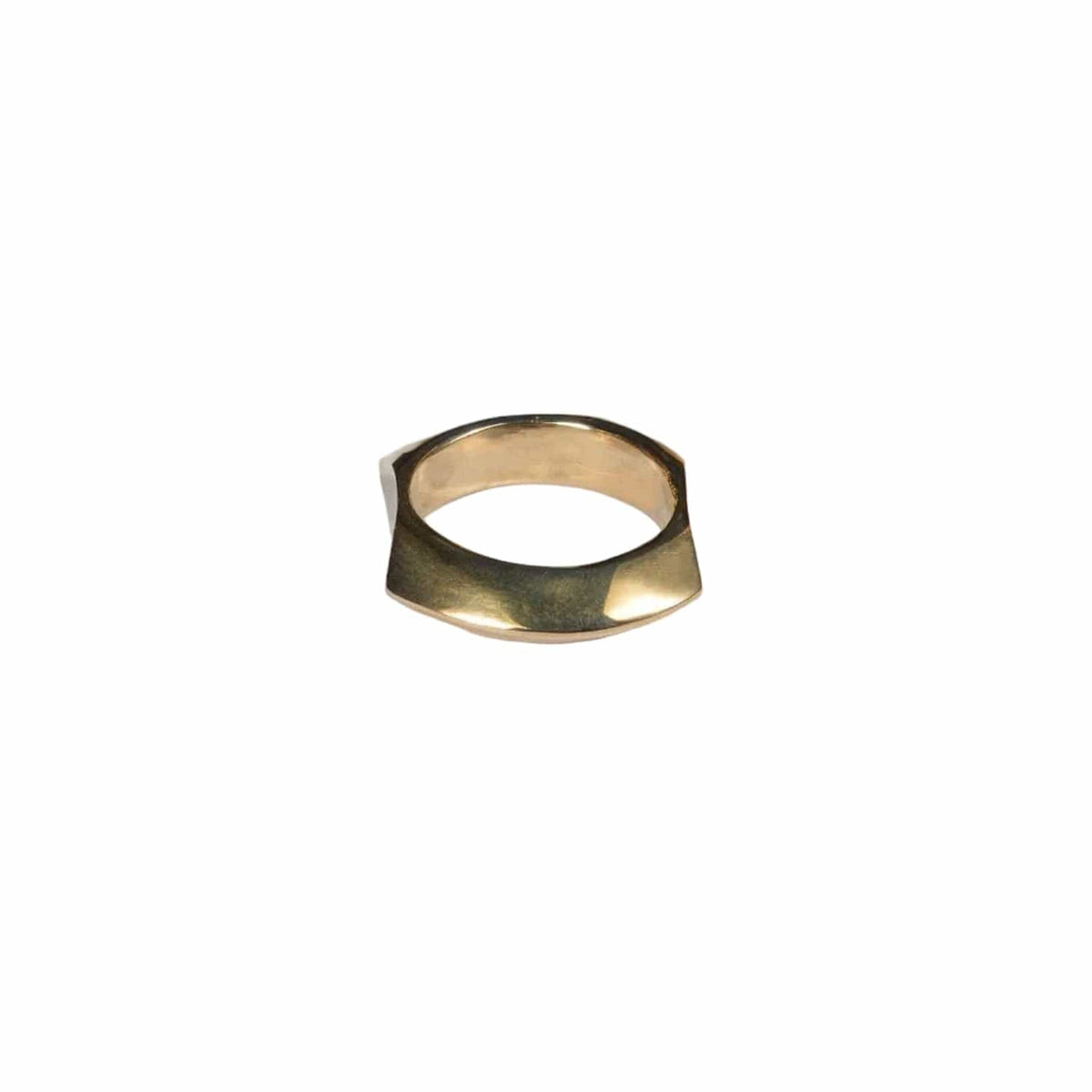 Gold ring on a light gray background