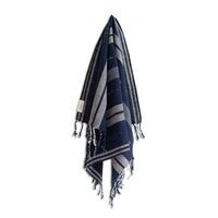 Navy and gray striped towel with tassels on a white background