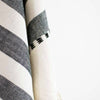 Close-up of a black and white checkered fabric with a blurred background