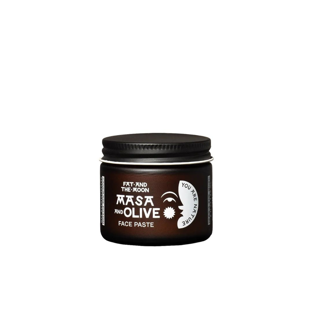 Jar of Masa and Olive face paste on a white background