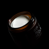 Jar of 'All Cream' with a dark background