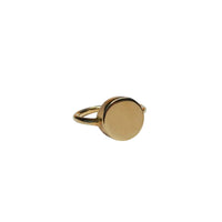 Gold ring on a white background