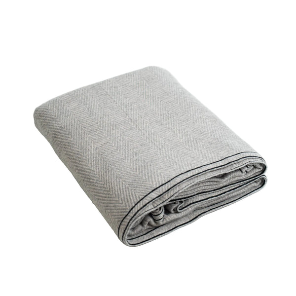 folded gray cashmere blanket on white background