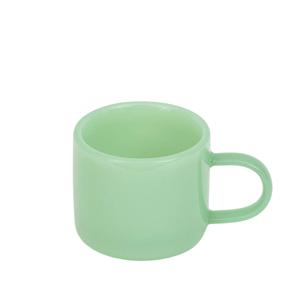 Green espresso cup on a white background