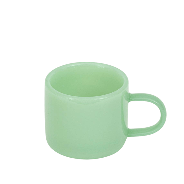 Green espresso cup on a white background