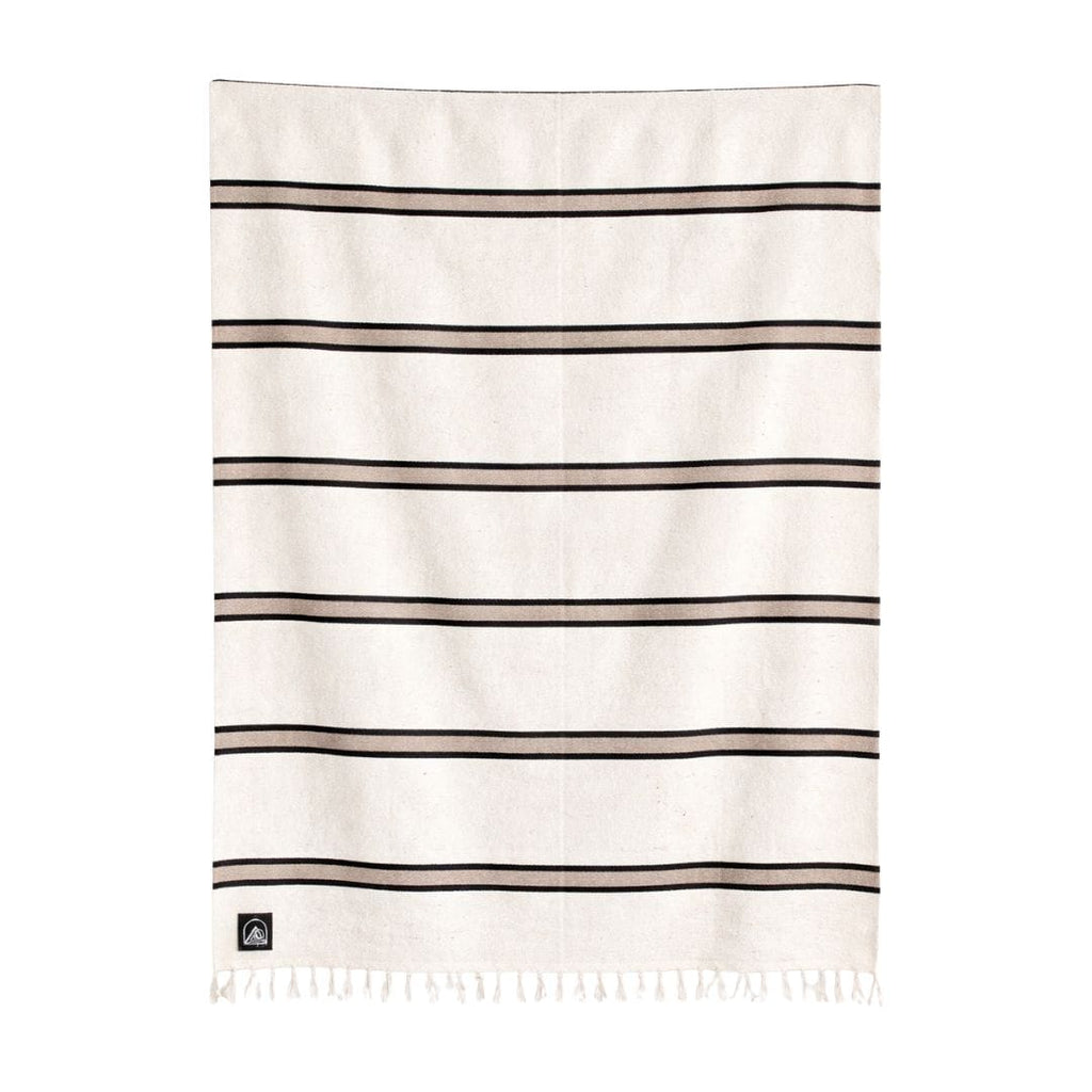 Beige blanket with black stripes on a white background