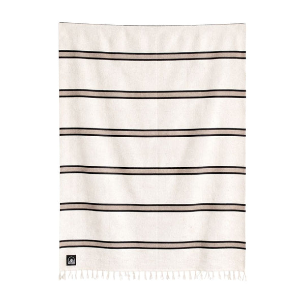 Beige blanket with black stripes on a white background