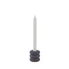 Candle holder with a white candle on a white background