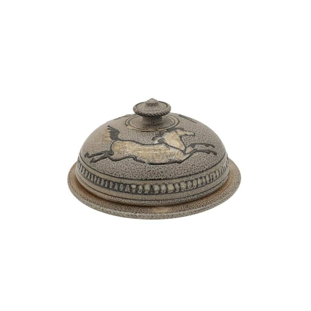 Decorative ceramic cover with a horse design on a white background
