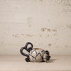 Ceramic teapot with blue patterns on a textured beige background