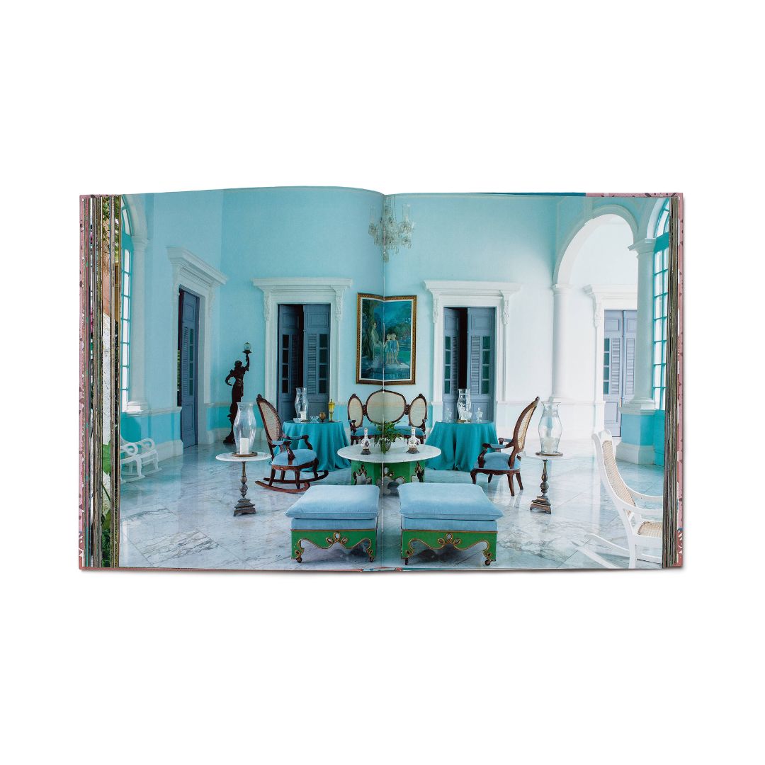 Opulent interior design with blue walls, elegant furniture, and decorative elements.