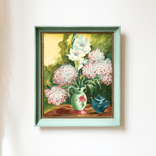 Framed painting of flowers and vases on a white wall