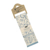 Decorative kitchen towel with blue floral pattern in packaging on a white background