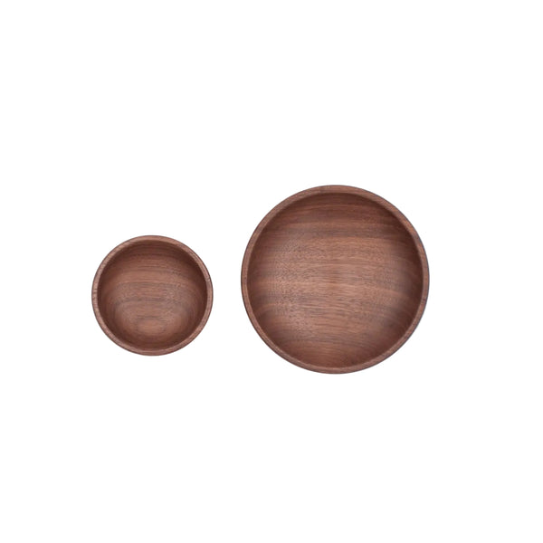 Two wooden bowls on a white background