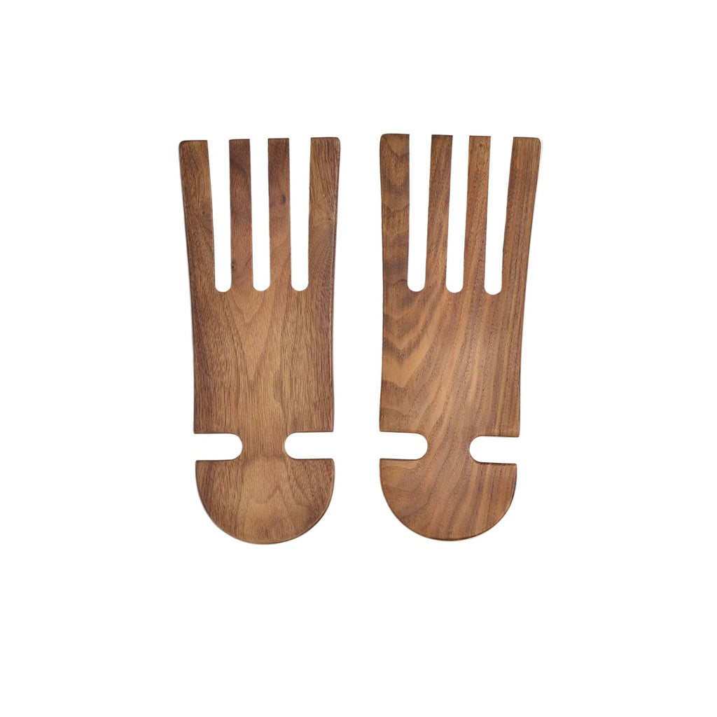 Two wooden salad servers on a white background