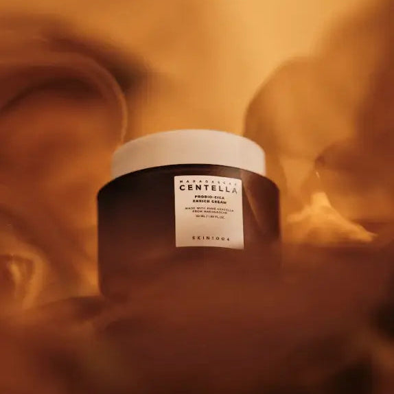 Jar of skincare cream with a label on a soft, blurred background