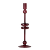A tall, slender burgundy glass candlestick holder with decorative rounded sections, shown on a plain white background.