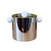 A polished chrome cylindrical container with a lid and three white spherical handles, photographed on a plain white background.